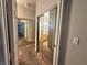 Hallway with mirrored closet doors leading towards the bathroom and bedroom at 5650 E Sahara Ave # 1035, Las Vegas, NV 89142