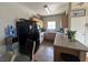Bright eat-in kitchen showcasing updated appliances and a cozy dining area, with a view of the backyard at 5650 E Sahara Ave # 1035, Las Vegas, NV 89142