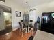 An eat-in kitchen that includes a glass-topped dining table next to the kitchen and stainless steel appliances at 5650 E Sahara Ave # 1035, Las Vegas, NV 89142