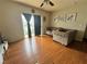 A warm and inviting living room featuring hardwood floors, neutral walls, and sliding glass door to the outside at 5650 E Sahara Ave # 1035, Las Vegas, NV 89142