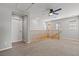 Loft space features neutral carpet, a ceiling fan, and staircase access to the level below at 5808 Sierra Cliff St, North Las Vegas, NV 89031