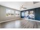 Inviting bedroom showcases a stylish accent wall and large windows for abundant natural light at 5981 Smith Valley Rd, Las Vegas, NV 89148