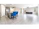 Open-concept living area with a modern kitchen island, stainless steel appliances, and ample seating at 5981 Smith Valley Rd, Las Vegas, NV 89148