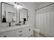 Clean bathroom with double vanity, subway tile, and modern fixtures at 6077 Honeysuckle Ridge St, Las Vegas, NV 89148