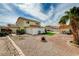 Expansive backyard with rock landscaping, small patio, storage shed, and privacy fence at 6538 Astorville Ct, Las Vegas, NV 89110