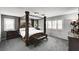 Bedroom featuring a unique four-poster bed, neutral colors, and plantation shutters at 6538 Astorville Ct, Las Vegas, NV 89110