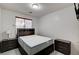 Bedroom featuring a bed, two nightstands, and a window at 6538 Astorville Ct, Las Vegas, NV 89110