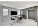 Modern dining room featuring a stylish table, fireplace, and ample natural light at 6538 Astorville Ct, Las Vegas, NV 89110