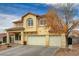 The home is beautifully accentuated by mature landscaping, a red tile roof and a stucco exterior at 6538 Astorville Ct, Las Vegas, NV 89110