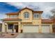 A detailed view of the home's stucco exterior with a red tile roof and a three-car garage at 6538 Astorville Ct, Las Vegas, NV 89110