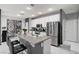 Modern kitchen features a breakfast bar, white cabinets, and stainless steel appliances at 6538 Astorville Ct, Las Vegas, NV 89110