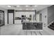 Modern kitchen features white cabinets, stainless steel appliances, and breakfast bar seating at 6538 Astorville Ct, Las Vegas, NV 89110