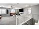 Second floor living room area with carpet, a ceiling fan, television, and a couch at 6538 Astorville Ct, Las Vegas, NV 89110