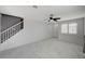Open-concept living room with marble floors, recessed lighting, and access to the staircase at 6538 Astorville Ct, Las Vegas, NV 89110
