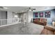 Second floor living room area with carpet, ceiling fan, sofas, a glass table, and wall art at 6538 Astorville Ct, Las Vegas, NV 89110