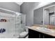 A well-maintained bathroom with a shower, toilet, and sink with a large mirror for convenience at 6971 Moaning Cavern St, Las Vegas, NV 89131