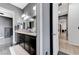 Bathroom featuring a double vanity with dark wood cabinets and gray walls at 6971 Moaning Cavern St, Las Vegas, NV 89131
