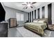 Modern bedroom showcasing a decorative accent wall, a comfortable bed, and stylish furnishings at 6971 Moaning Cavern St, Las Vegas, NV 89131