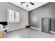 Bedroom area with a window, tile flooring, and a safe on the wall at 6971 Moaning Cavern St, Las Vegas, NV 89131