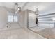 Neutral dining room with tiled floor and lots of light at 6971 Moaning Cavern St, Las Vegas, NV 89131