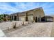 Long brick driveway leads to a three-car garage and gated entrance at 6971 Moaning Cavern St, Las Vegas, NV 89131