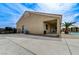 Rear exterior view showing a covered patio, well-maintained yard, and access to the backyard pool area at 6971 Moaning Cavern St, Las Vegas, NV 89131