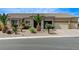 Charming single-story home featuring a three-car garage and desert landscaping at 6971 Moaning Cavern St, Las Vegas, NV 89131