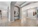 Open foyer with tile flooring and arched doorways to adjacent living spaces at 6971 Moaning Cavern St, Las Vegas, NV 89131