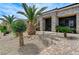 Elegant front entrance with wrought iron gate and stone accents at 6971 Moaning Cavern St, Las Vegas, NV 89131