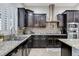 Well-appointed kitchen featuring stainless steel appliances and mosaic backsplash at 6971 Moaning Cavern St, Las Vegas, NV 89131
