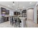 Spacious kitchen with granite countertops, stainless steel appliances, and center island at 6971 Moaning Cavern St, Las Vegas, NV 89131