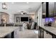 Open concept living room, adjacent to kitchen, features tiled flooring and recessed lighting at 6971 Moaning Cavern St, Las Vegas, NV 89131