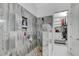Elegant bathroom showcasing a spacious tiled shower, dual sinks, and a walk-in closet at 6971 Moaning Cavern St, Las Vegas, NV 89131