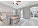 Spacious main bedroom with a rug, and an ensuite bathroom with a large shower at 6971 Moaning Cavern St, Las Vegas, NV 89131