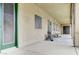 Covered patio area, offering outdoor seating and access to backyard at 6971 Moaning Cavern St, Las Vegas, NV 89131
