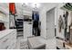 Spacious walk-in closet with custom shelving, ample storage, and organized hanging space at 6971 Moaning Cavern St, Las Vegas, NV 89131
