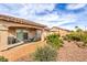 Spacious backyard with low maintenance landscaping, covered patio, and room for outdoor activities at 7264 Summer Duck Way, North Las Vegas, NV 89084