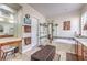 Bright bathroom featuring double sinks, a soaking tub, and a glass-enclosed shower at 7264 Summer Duck Way, North Las Vegas, NV 89084