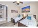 Clean bedroom with twin beds, carpet, and ceiling fan at 7264 Summer Duck Way, North Las Vegas, NV 89084