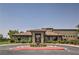 Attractive building exterior showing clubhouse with manicured landscaping and circular driveway at 7264 Summer Duck Way, North Las Vegas, NV 89084