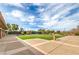 Green lawns with walking paths and common areas for gathering near the clubhouse and pickleball courts at 7264 Summer Duck Way, North Las Vegas, NV 89084