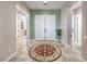 Bright entryway features a large round rug and double doors at 7264 Summer Duck Way, North Las Vegas, NV 89084