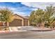 Inviting single story home with a three car garage and desert landscaping at 7264 Summer Duck Way, North Las Vegas, NV 89084