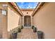 Inviting front door with desert landscaping and a covered walkway at 7264 Summer Duck Way, North Las Vegas, NV 89084