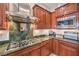 A modern kitchen highlighting a stainless steel range hood and high-end appliances at 7264 Summer Duck Way, North Las Vegas, NV 89084
