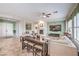 Open floorplan living room features a fireplace and access to the dining room at 7264 Summer Duck Way, North Las Vegas, NV 89084