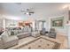 Open floorplan living room with tile flooring and access to the front door at 7264 Summer Duck Way, North Las Vegas, NV 89084