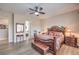 Spacious main bedroom with hardwood floors, ceiling fan, ensuite, and luxury finishes at 7264 Summer Duck Way, North Las Vegas, NV 89084