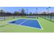 Play a match on the outdoor pickleball court with green and blue surface and dark net at 7264 Summer Duck Way, North Las Vegas, NV 89084