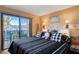 Cozy bedroom with access to a private outdoor patio space with seating at 775 Cathy Ln, Henderson, NV 89015